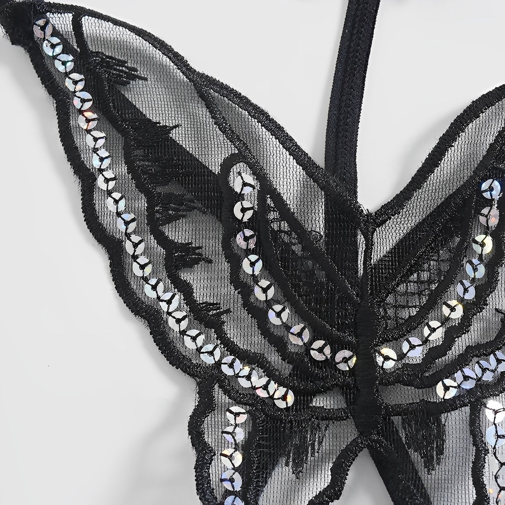Calcinha preta com desenho de borboleta em renda e detalhes brilhantes, detalhe da renda
