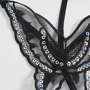 Calcinha preta com desenho de borboleta em renda e detalhes brilhantes, detalhe da renda